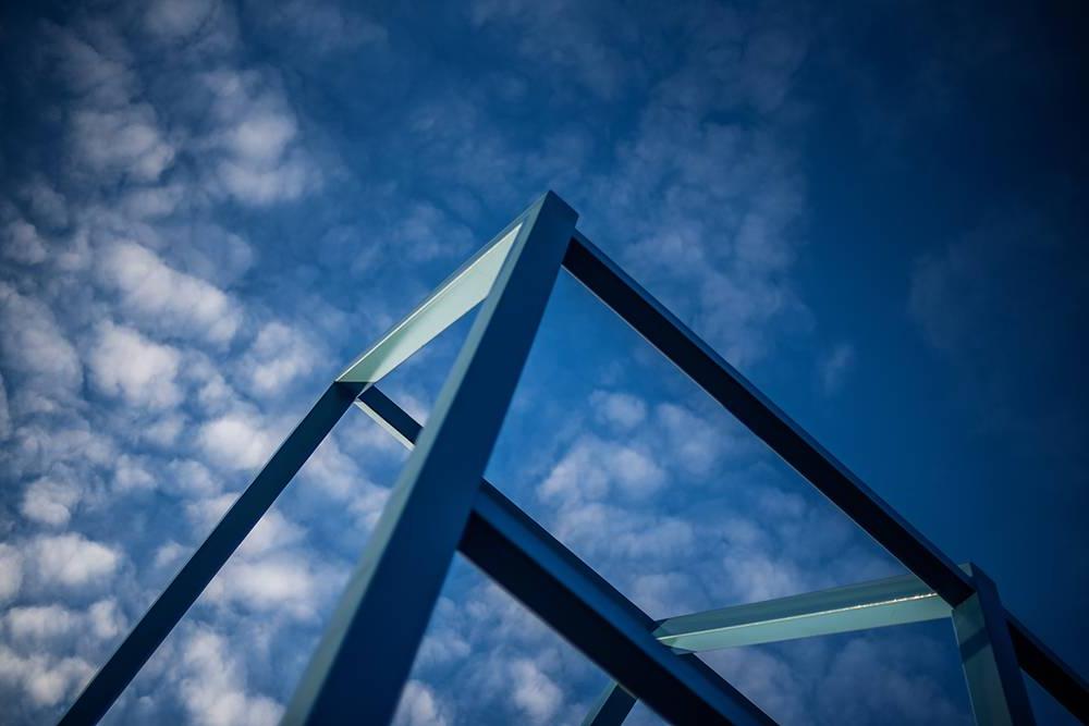 Looking up at blue sky and art sculpture at GVSU